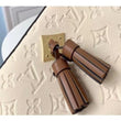 LV Saintonge Monogram Empreinte Leather Creme Caramel